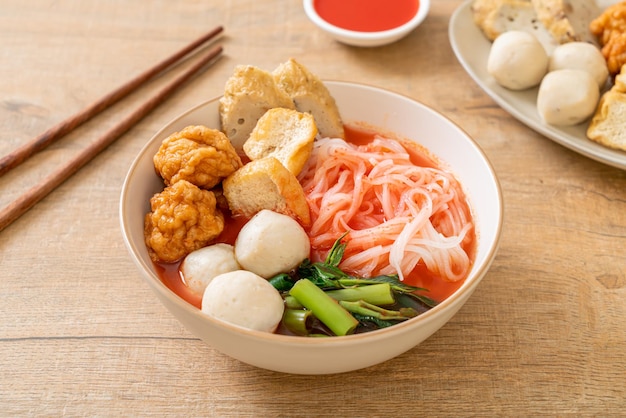 Small flat rice noodles with fish balls and shrimp balls in pink soup Yen Ta Four or Yen Ta Fo