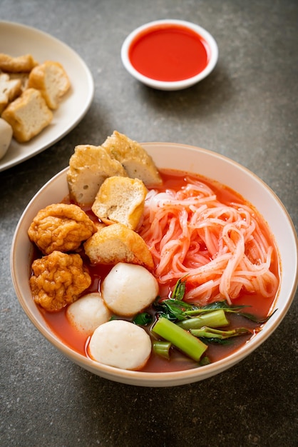 Small flat rice noodles with fish balls and shrimp balls in pink soup Yen Ta Four or Yen Ta Fo