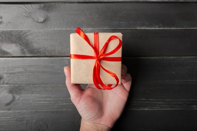 Small gift box with red ribbon close up