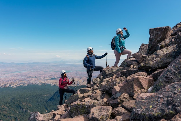 Small group of people at team building in a hiking walk on a mountain