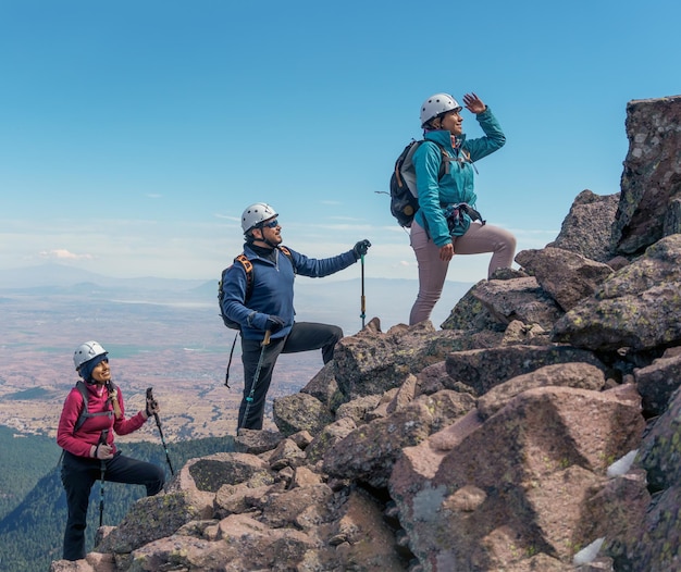 Small group of people at team building in a hiking walk on a mountain