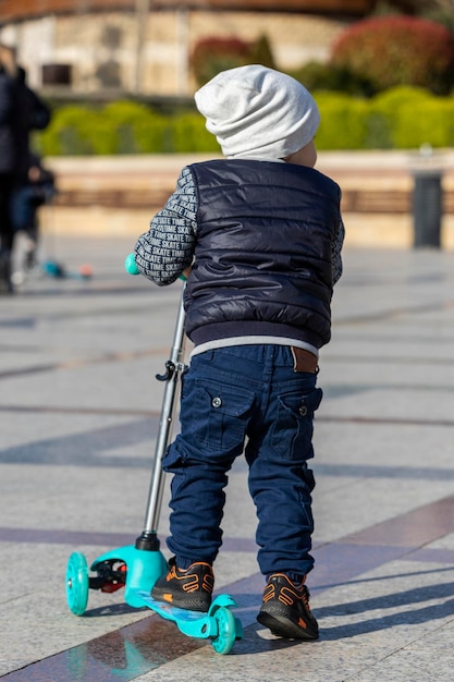 Small kid riding skate at street High quality photo