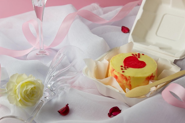 A small Korean-style bento cake in a box for one person. Cute dessert gift for birthday and valentine's day. Selective focus.