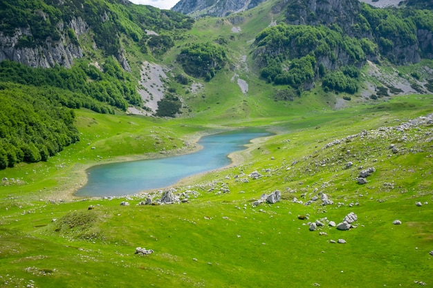 A small mountain lake among the high picturesque mountains.