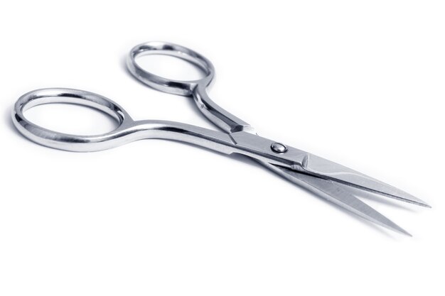 Small nail scissors with stainless steel isolated on white background.