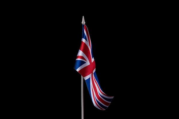 Small national flags of the united kingdom on a dark background