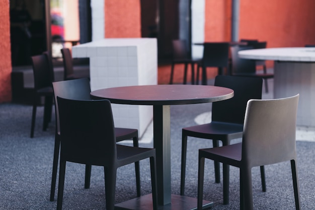 Small outdoor summer cafes, on the streets, a place to relax, table and chairs in front of a cafe