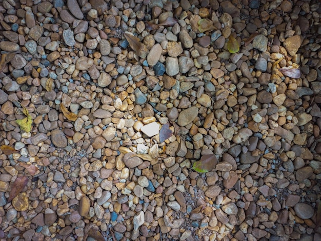 Small pebbles, brown, little sunlight.