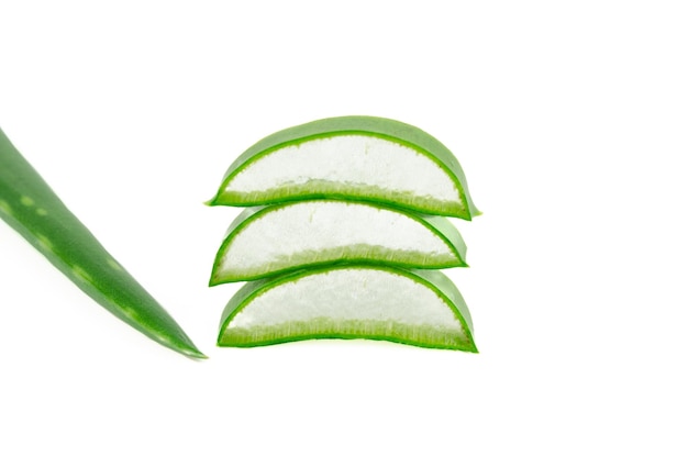 Small pieces of an aloe vera leaf forming a pile on a white background