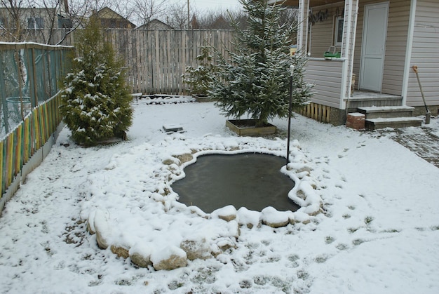 A small pond on a snowy morning. Ryazan region. Russia