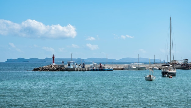 Small port in the mediterranean with an island on the back