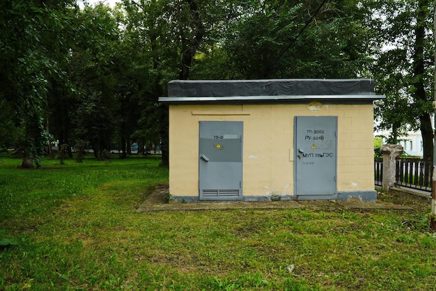 A small power plant building with two doors