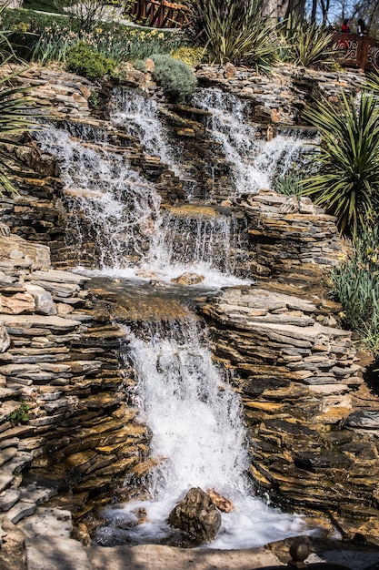 Small rocky waterfall pouring into a lake