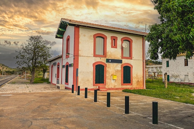 Small rural railway station with a cloudy sky