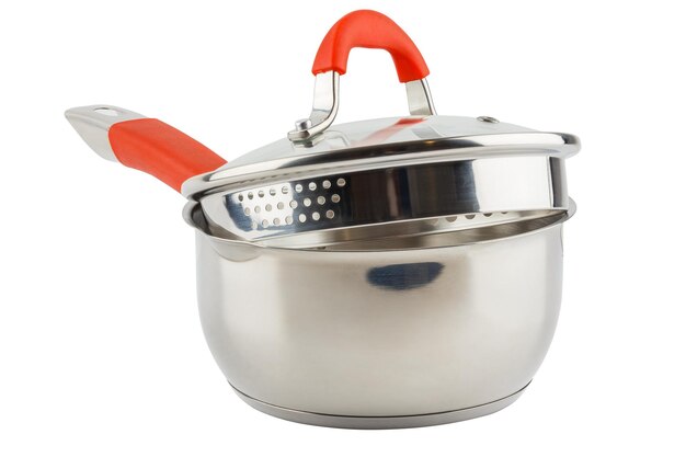 Small shiny stainless steel pot with orange handle and glass lid isolated on white