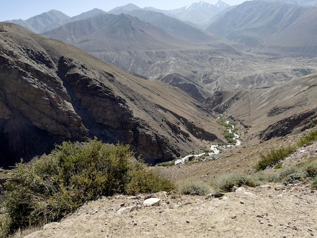 A small stream meanders down to the big river