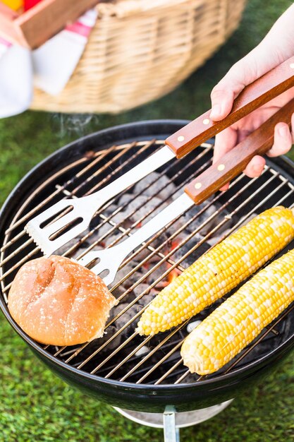 Small summer picnic with lemonade and hamburgers in the park.