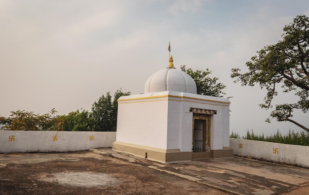 Small temple on mountain with white mist