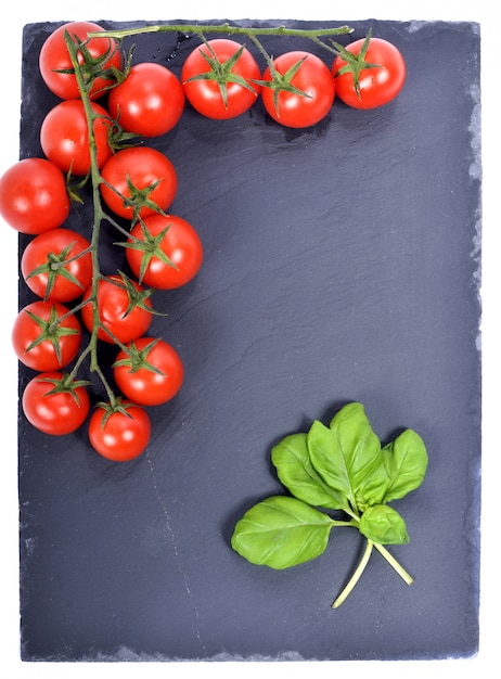 Small tomatoes presented on a slate plate