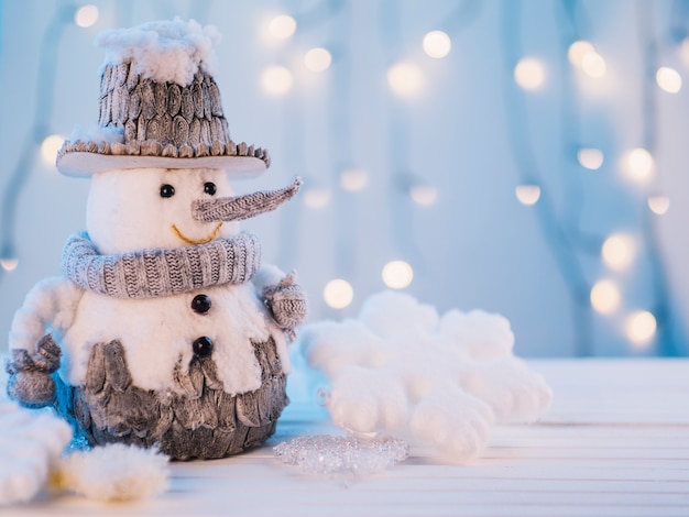 Small toy snowman on table 