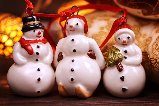 Small toy snowmans on christmas decorations table