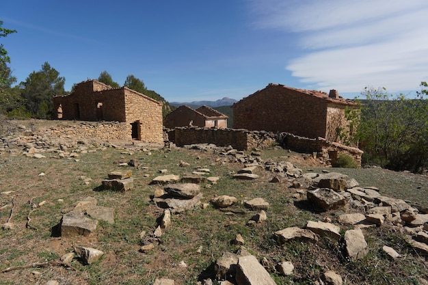 A small village with a mountain in the background