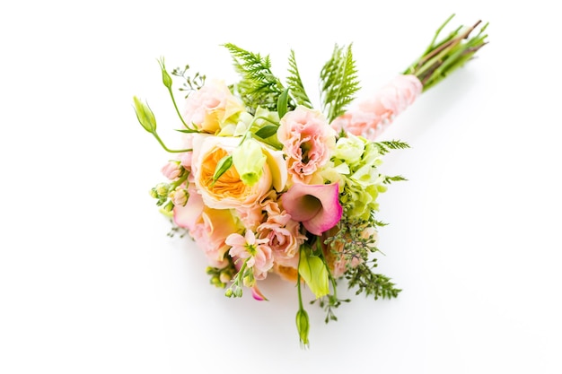 Small wedding bouquet with roses on a white background.