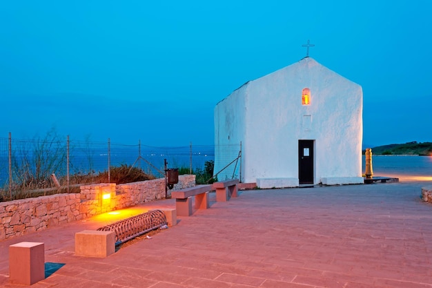 Small white church at dusk