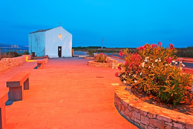 Small white church at dusk