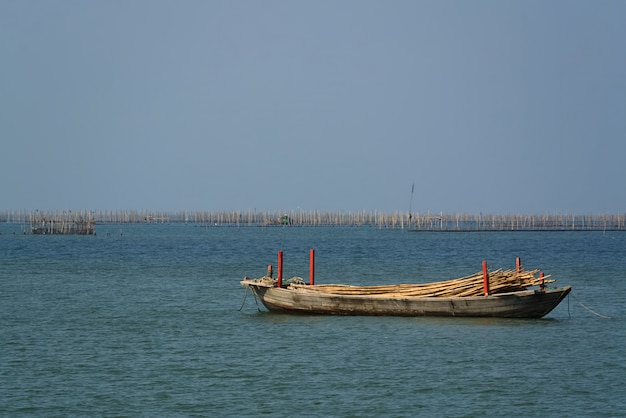 Small Wooden Boat Floating in The Sea