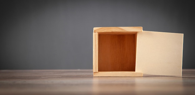 Small wooden box on the wooden table