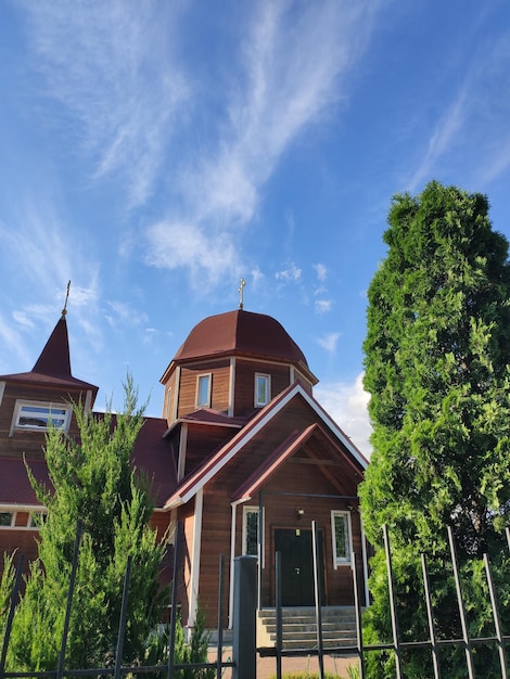 Small wooden church against the blue sky