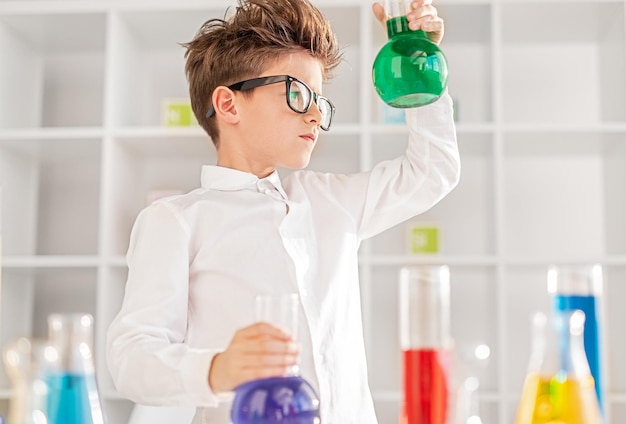 Smart boy conducting chemical experiment