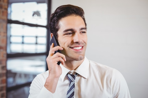 Smart businessman talking on mobile phone