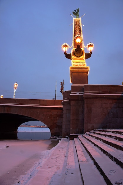 A smart city with luminous sculptures adorned with garlands.