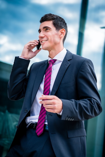 Smart dressed man talking in phone