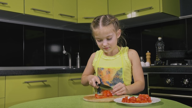 Smart girl learning to cook Young mistress children to cook a Neapolitan egg fried omelette