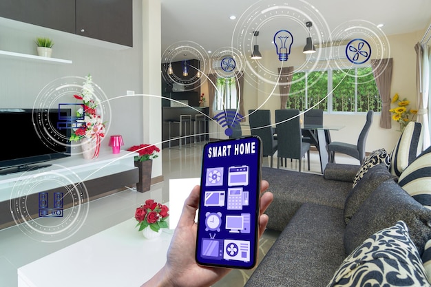 Smart Home and augmented reality Technology concept Hand holding smart phone