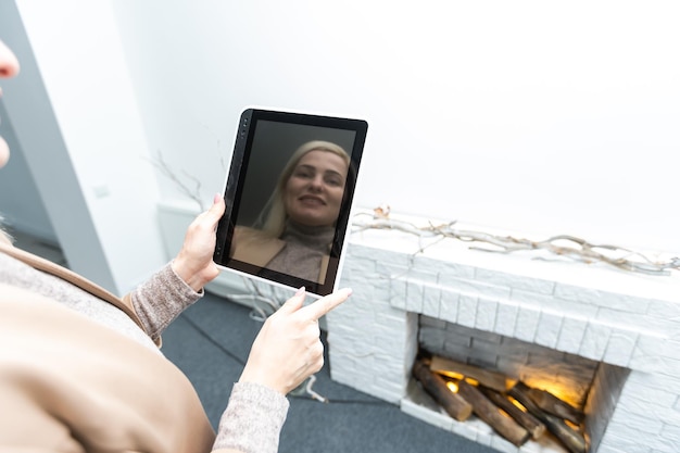 Smart Home: woman Controlling Blinds With His tablet