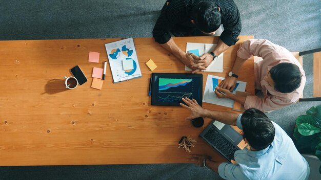 Smart manager explain financial graph to colleague at meeting room convocation