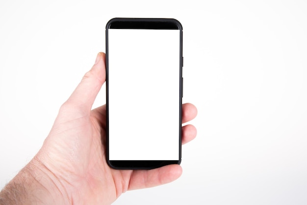 Smart phone blank white screen mockup model black in male hand with empty face copy space