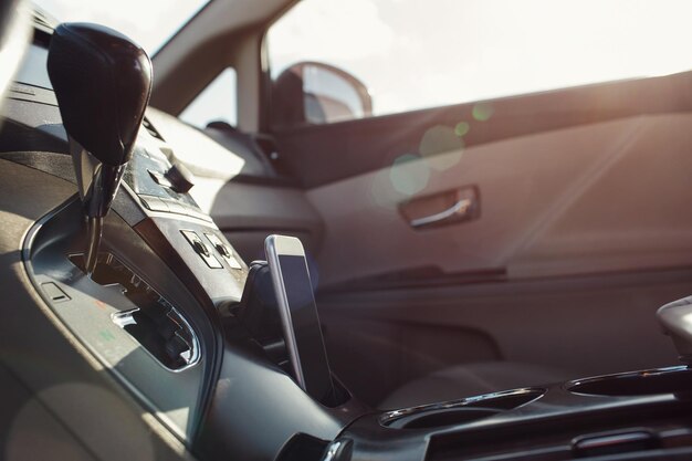 Smart phone phone on the car seat dashboard