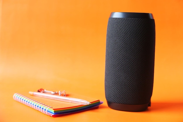 smart speaker and keyboard with copy space on orange background background