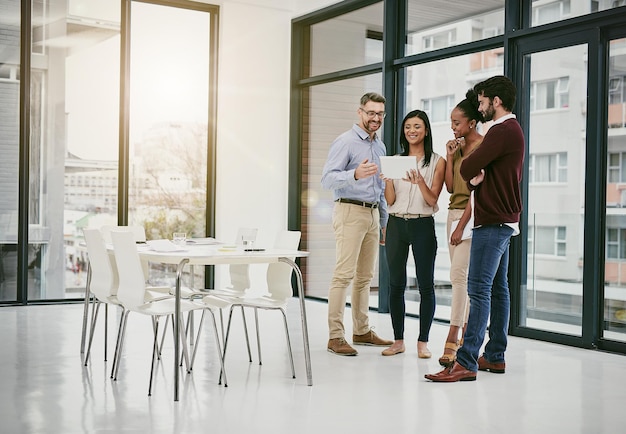 The smart team is a productive team Shot of a group of colleagues having a meeting in a modern office