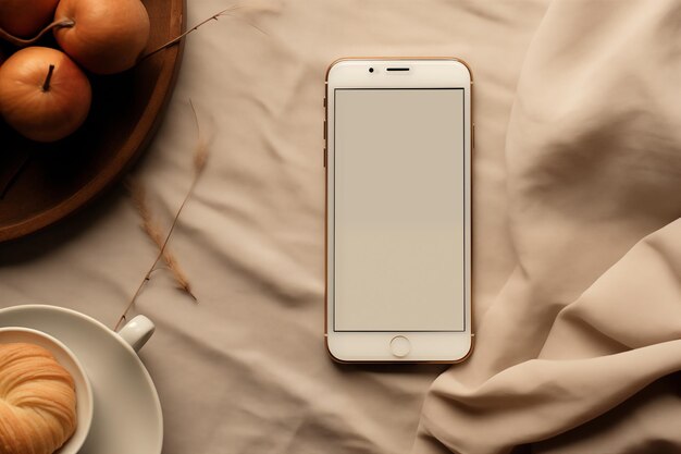 Smartphone Beside Coffee and Apples on a Neutral Background