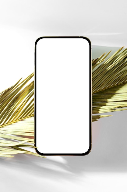 Smartphone mockup with palm leaf on white background Device screen mock up on stylish background for presentation or appl design