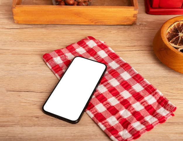 Smartphone screen mockup mobile phone mock up on kitchen table wooden counter