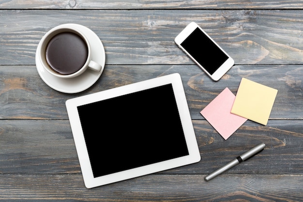 Smartphone with blank screen and table pc on  background