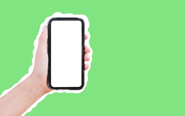 Smartphone with mockup in male hand isolated with white contour on green