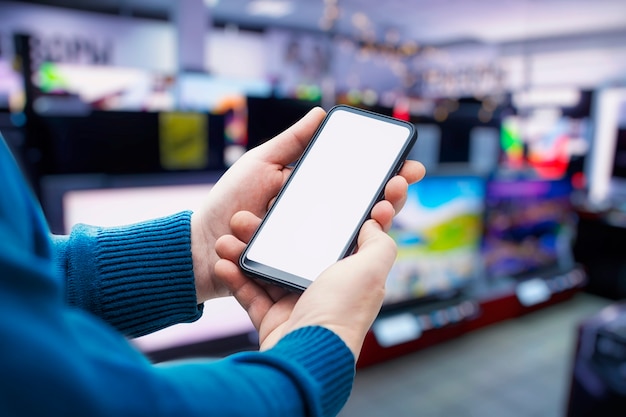 smartphone with a white screen in the hands of a man